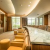 lounge room with a TV and ample seating